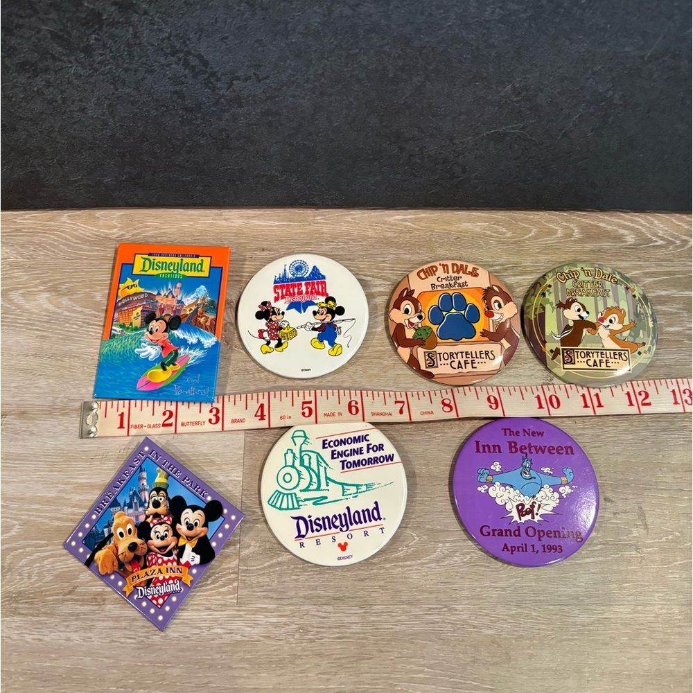 Disneyland button collection spanning 1988 to the early 2000s